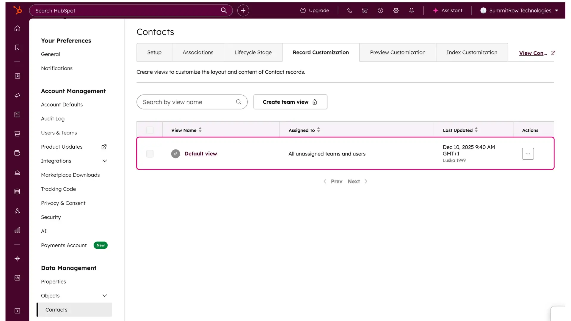 The HubSpot Record Customization list view. The Default view row is highlighted in a pink box, showing where to click to edit the standard layout for all unassigned teams and users.